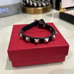Black Valentino bracelet with gold studs